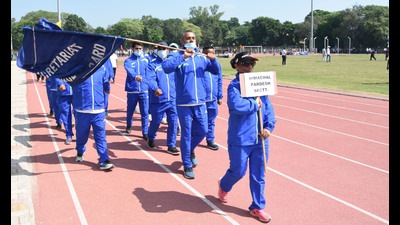 Participants taking out a parade march during the three-day All India Civil Services Athletics Tournament. (HT Photo)