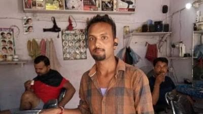 Winner Ashok Thakur runs a salon at Nanaur Chouk under the Andhratharhi block of Madhubani district. (HT Photo)