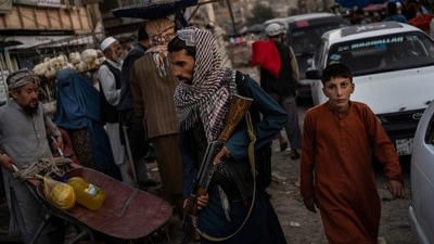 Taliban fighters patrol a market in Kabul's Old City. (AP File Photo)