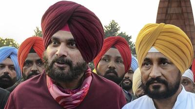 Punjab chief minister Charanjit Singh Channi with state Congress chief Navjot Singh Sidhu, at Jallianwala Bagh in Amritsar. (PTI) Punjab chief minister Charanjit Singh Channi with state Congress chief Navjot Singh Sidhu, at Jallianwala Bagh in Amritsar. (PTI)
