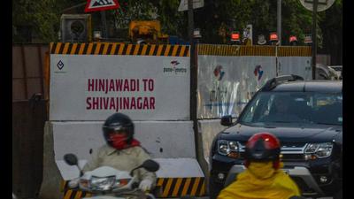 A board stating ongoing work of Shivajinagar to Hinjewadi metro in Pune. PMC tells PMRDA to lay cables for metro route after monsoons. (HT FILE)