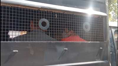 A CBI team taking the accused from Naini Central Jail to Reserve Police Lines in Prayagraj on Tuesday for interrogation. In his purported suicide note, Mahant Narendra Giri had alleged that Anand Giri was threatening to release a morphed video showing him in a compromising position with a woman. (HT photo) A CBI team taking the accused from Naini Central Jail to Reserve Police Lines in Prayagraj on Tuesday for interrogation. In his purported suicide note, Mahant Narendra Giri had alleged that Anand Giri was threatening to release a morphed video showing him in a compromising position with a woman. (HT photo)