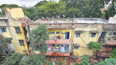 A three-storey staff quarters of Bangalore Milk Union Limited (BAMUL) came crashing down near dairy circle in Bengaluru on Tuesday. (PTI) A three-storey staff quarters of Bangalore Milk Union Limited (BAMUL) came crashing down near dairy circle in Bengaluru on Tuesday. (PTI)