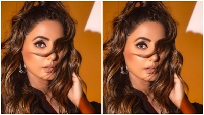 The velvety black attire has a plunging neckline with Mandarin collars. (Instagram/@realhinakhan)