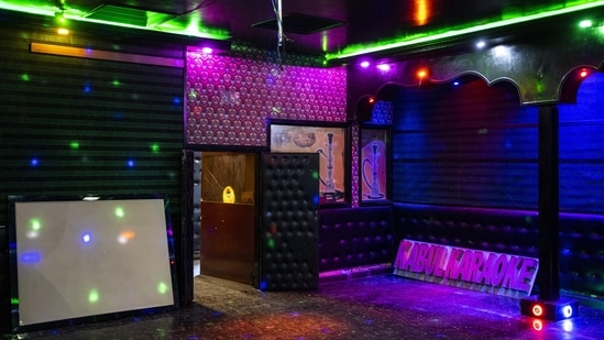 Lights shine at a no longer operative Karaoke hall in Kabul, on September 21. Some karaoke parlors have closed. Others still open face harassment, AP reported.(Bernat Armangue / AP)