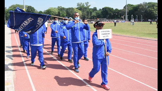 Participants taking out a parade march during the three-day All India Civil Services Athletics Tournament. (HT Photo)