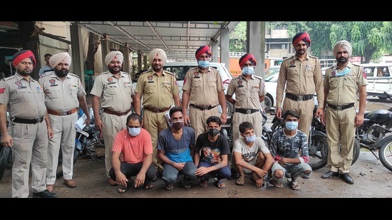 The men accused of vehicle lifting and snatching in police custody in Ludhiana on Tuesday. (HT photo)