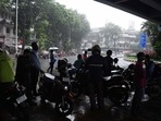 Commuters take shelter under a bridge amid heavy rainfall, in Mumbai on Tuesday. (ANI Photo) Commuters take shelter under a bridge amid heavy rainfall, in Mumbai on Tuesday. (ANI Photo)