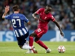 Porto's Sergio Oliveira vies for the ball with Liverpool's Sadio Mane, right, during the Champions League group B soccer match between FC Porto and Liverpool at the Dragao stadium in Porto, Portugal, Tuesday, Sept. 28, 2021. Porto's Sergio Oliveira vies for the ball with Liverpool's Sadio Mane, right, during the Champions League group B soccer match between FC Porto and Liverpool at the Dragao stadium in Porto, Portugal, Tuesday, Sept. 28, 2021.
