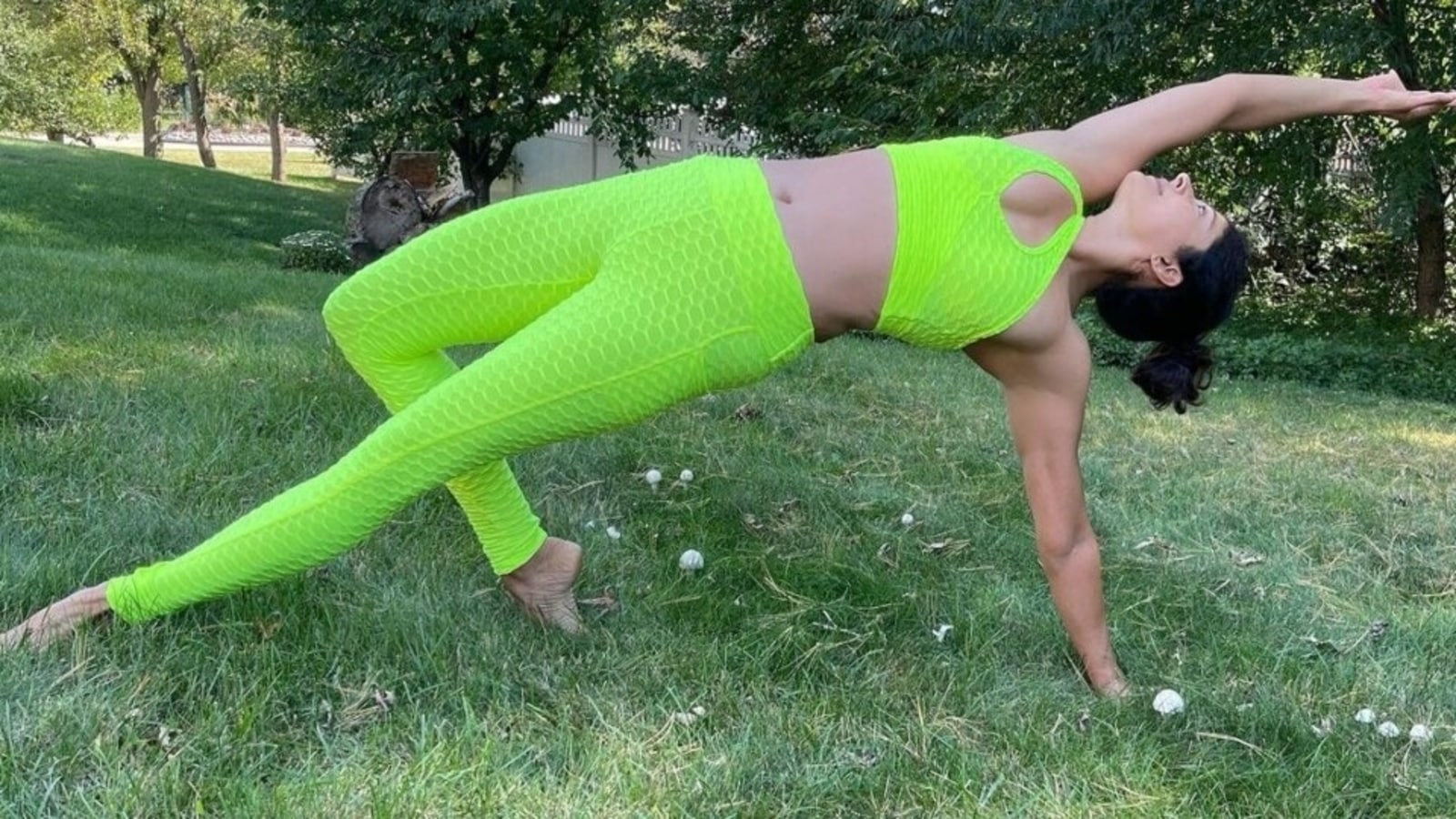 Pooja Batra in neon-green sports bra and tights does yoga. Nawab