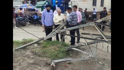 The damaged 66-kv electricity tower at Gill Road on Tuesday. Following the accident, power outages were reported from nearby areas. (HT photo)