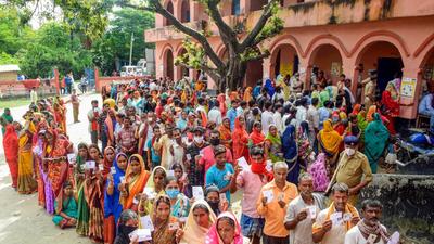 People stand in queues to cast their votes for the second phase of the Bihar Panchayat elections 2021, in Hajipur, Wednesday. (PTI) People stand in queues to cast their votes for the second phase of the Bihar Panchayat elections 2021, in Hajipur, Wednesday. (PTI)