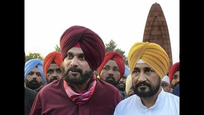Navjot Singh Sidhu with Punjab chief minister Charanjit Singh Channi during a recent visit to Jallianwala Bagh in Amritsar. Sidhu, who quit as state Congress chief on Tuesday, is upset with the Channi cabinet expansion and appointments to top police and legal posts. (ANI file photo) Navjot Singh Sidhu with Punjab chief minister Charanjit Singh Channi during a recent visit to Jallianwala Bagh in Amritsar. Sidhu, who quit as state Congress chief on Tuesday, is upset with the Channi cabinet expansion and appointments to top police and legal posts. (ANI file photo)