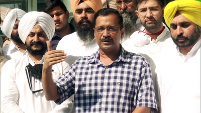 Aam Aadmi Party national convener and Delhi chief minister Arvind Kejriwal speaks to the media at the Chandigarh airport on Wednesday as party’s Punjab president Bhagwant Mann (right) looks on. (ANI)
