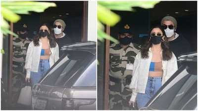 Ranbir completed his airport look with chunky lace-up dad sneakers, a camo print backpack, tinted sunglasses, a white face mask, and an olive green beenie.&nbsp; (HT Photo/Varinder Chawla)