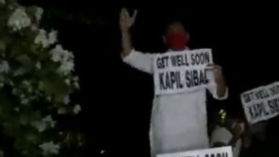 Congress workers protesting outside Kapil Sibal's residence in New Delhi.