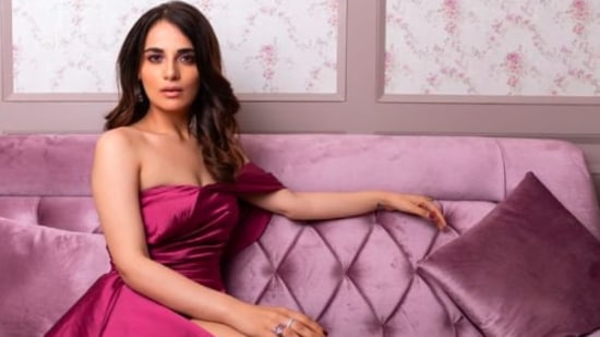 Radhika Madan posed like a queen on a violet couch donning a similar shade fit.(Instagram/@radhikamadan)