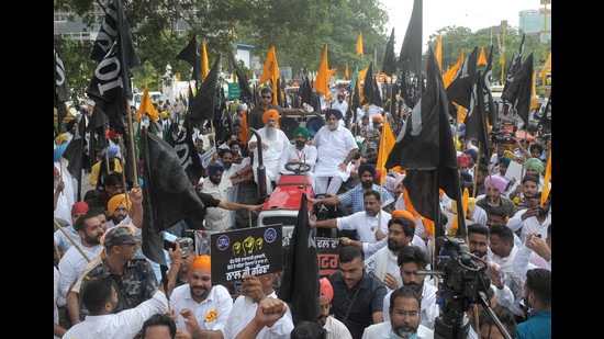 Shiromani Akali Dal president Sukhbir Singh Badal leading a tractor march in Mohali towards Punjab CM’s residence in protest against inadequate land compensation for farmers.