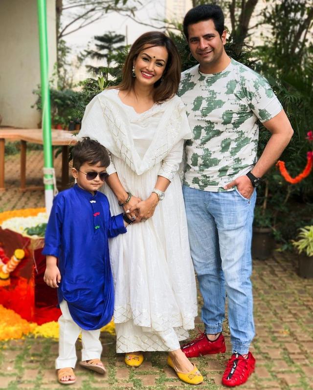 In happier times with wife Nisha Rawal and son Kavish.