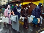 Polling officials carrying voting materials leave for poll duty amid rains, on the eve of Bhabanipur by-election, in Kolkata on Wednesday.(ANI Photo) Polling officials carrying voting materials leave for poll duty amid rains, on the eve of Bhabanipur by-election, in Kolkata on Wednesday.(ANI Photo)