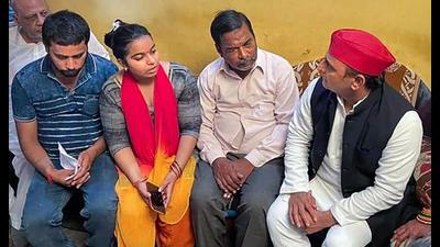 Samajwadi Party Chief Akhilesh Yadav meets the family of Manish Gupta, who was allegedly killed by police, in Gorakhpur, in Kanpur, Thursday, (PTI Photo)