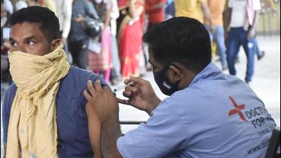 A health worker administers a dose of Covid-19 vaccine at Ghantaghar Ramlila Maidan in Ghaziabad on Wednesday. (Sakib Ali/HT Photo) A health worker administers a dose of Covid-19 vaccine at Ghantaghar Ramlila Maidan in Ghaziabad on Wednesday. (Sakib Ali/HT Photo)