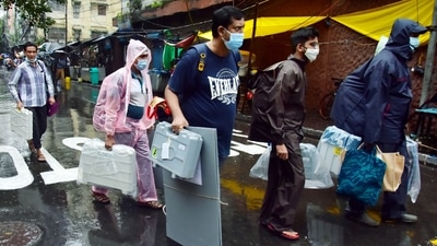 Polling officials carrying voting materials leave for poll duty amid rains, on the eve of Bhabanipur by-election, in Kolkata on Wednesday. (ANI Photo) Polling officials carrying voting materials leave for poll duty amid rains, on the eve of Bhabanipur by-election, in Kolkata on Wednesday. (ANI Photo)