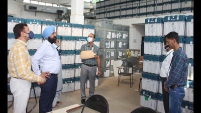 District election officer-cum-deputy commissioner Varinder Kumar Sharma carrying out first-level checking of EVMs and VVPAT at PAU in Ludhiana on Thursday. It was done in view of the Election Commission of India’s (ECI) directives ahead of the Punjab assembly polls next year. (HT photo)