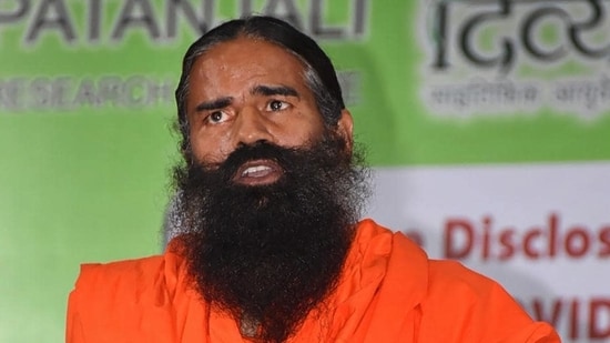 The capital markets regulator sent the letter after a video clip of Ramdev urging thousands of his followers to invest in the Ruchi Soya stock during a yoga session. (HT File Photo)
