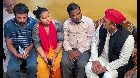 Samajwadi Party Chief Akhilesh Yadav meets the family of Manish Gupta, who was allegedly killed by police, in Gorakhpur, in Kanpur, Thursday, (PTI Photo)