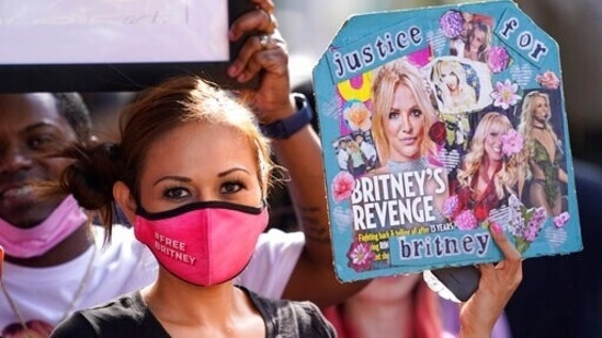A supporter of Britney Spears celebrates outside the Los Angeles courthouse after the verdict on conservatorship, on Wednesday.(AP Photo)