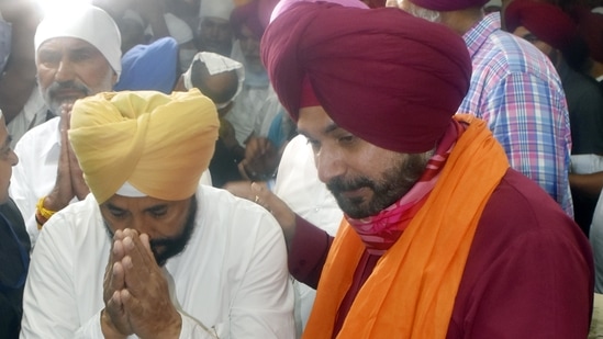 Navjot SIngh Sidhu with Punjab chief minister Charanjit Singh Channi at the Golden Temple in Amritsar.(Sameer Sehgal/HT Photo)