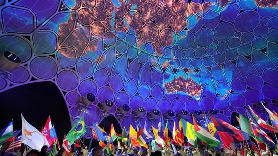 Flag-bearers for participating countries enter during the opening ceremony of the Dubai Expo 2020 on September 30.(AFP)