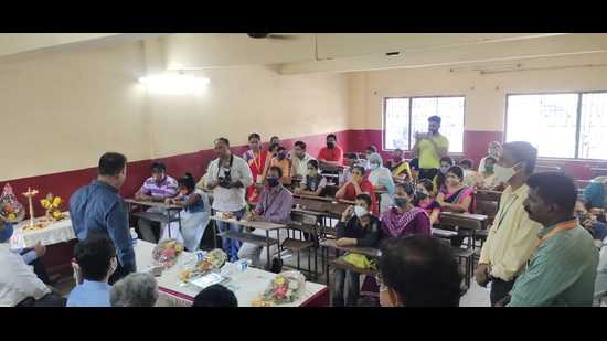 Members of the Soham Foundation in Ulhasnagar with the students and their family members seeking financial aid for their education recently. Fifty eight students, who lost one parent or both parents to Covid were finalised. (HT PHOTO)