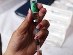 A health worker prepares a dose of the Covishield vaccine, developed by Oxford-AstraZeneca Plc. and manufactured by Serum Institute of India Ltd. (File Photo/Bloomberg)