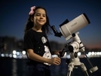 Brazilian 8-year-old astronomer Nicole Oliveira poses for a picture with her telescope in Fortaleza, Brazil.(AFP) Brazilian 8-year-old astronomer Nicole Oliveira poses for a picture with her telescope in Fortaleza, Brazil.(AFP)