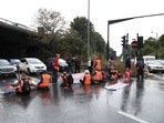 Britain activists block a motorway junction near Heathrow Airport, in London.