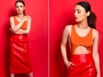 Recently, Radhika Madan shared a few pictures of herself in an orange cutout crop top and red high waisted fitted skirt.(Instagram/@radhikamadan) Recently, Radhika Madan shared a few pictures of herself in an orange cutout crop top and red high waisted fitted skirt.(Instagram/@radhikamadan)