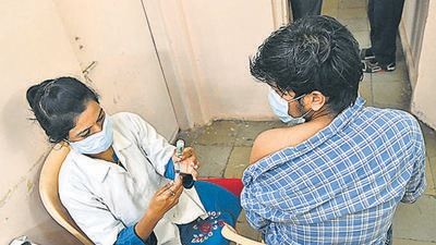 Beneficiary gets a vaccination jab in Pune. According to the state health department, Pune district has reported 748 new Covid-19 cases and three deaths due to the infection, on Friday. (HT)