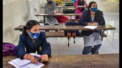 Students attend a class after the Karnataka government reopened schools after new Covid relaxations came into effect. (PTI) Students attend a class after the Karnataka government reopened schools after new Covid relaxations came into effect. (PTI)