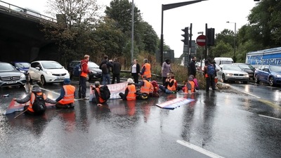 Britain activists block a motorway junction near Heathrow Airport, in London. (REUTERS)