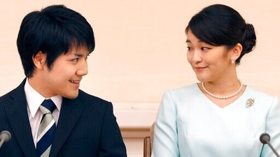 Japan's Princess Mako and her fiance Kei Komuro look at each other during a press conference at Akasaka East Residence in Tokyo. (AP Photo/Shizuo Kambayashi, Pool, File) (AP)