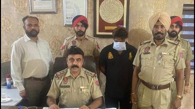 The labourer, who was held with 50gm heroin, in the custody of the anti-narcotics cell of Ludhiana on Friday. (HT PHOTO)