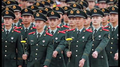 Members of Chinese People’s Liberation Army (PLA) prepare to lay flowers at the Monument to the People’s Heroes during a ceremony on Tiananmen Square to mark Martyr’s Day, in Beijing, China, on Thursday. (REUTERS) Members of Chinese People’s Liberation Army (PLA) prepare to lay flowers at the Monument to the People’s Heroes during a ceremony on Tiananmen Square to mark Martyr’s Day, in Beijing, China, on Thursday. (REUTERS)