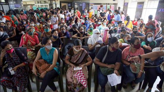 Beneficiaries wait to receive Covid-19 vaccine shots during a special drive organised for women by the Brihanmumbai Municipal Corporation in Mumbai, India. The United States has launched a public-private initiative to help women entrepreneurs in India. (PTI)