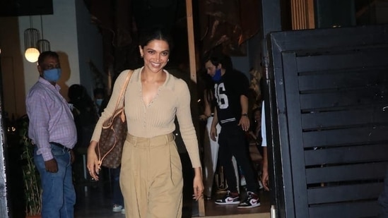 Deepika Padukone smiles for the paparazzi.