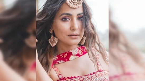 Hina Khan took to her Instagram handle to share a few stills of herself in a red indo-western lehenga.(Instagram/@realhinakhan)