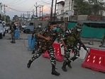 Security personnel arrive near the site where a man was shot dead by unknown gunmen in the Karanagar area of Srinagar on Saturday. (AFP) Security personnel arrive near the site where a man was shot dead by unknown gunmen in the Karanagar area of Srinagar on Saturday. (AFP)