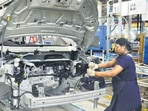 The manufacturing PMI rose from 52.3 in August to 53.7 in September. AFP