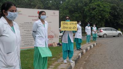 Contractual nurses who lost their jobs protesting at Matka chowk in Chandigarh on Saturday. (Ravi Kumar/HT) Contractual nurses who lost their jobs protesting at Matka chowk in Chandigarh on Saturday. (Ravi Kumar/HT)